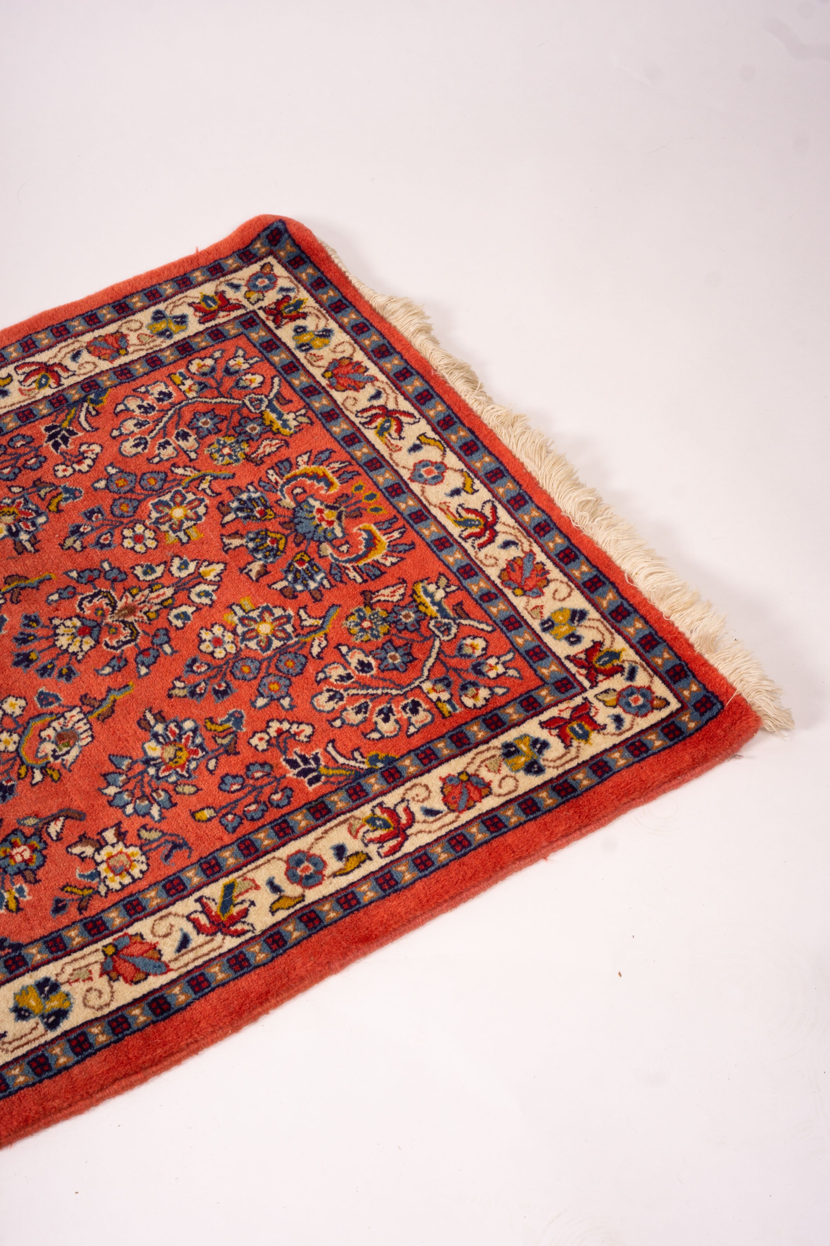 A Persian red ground runner, 202 x 83cm